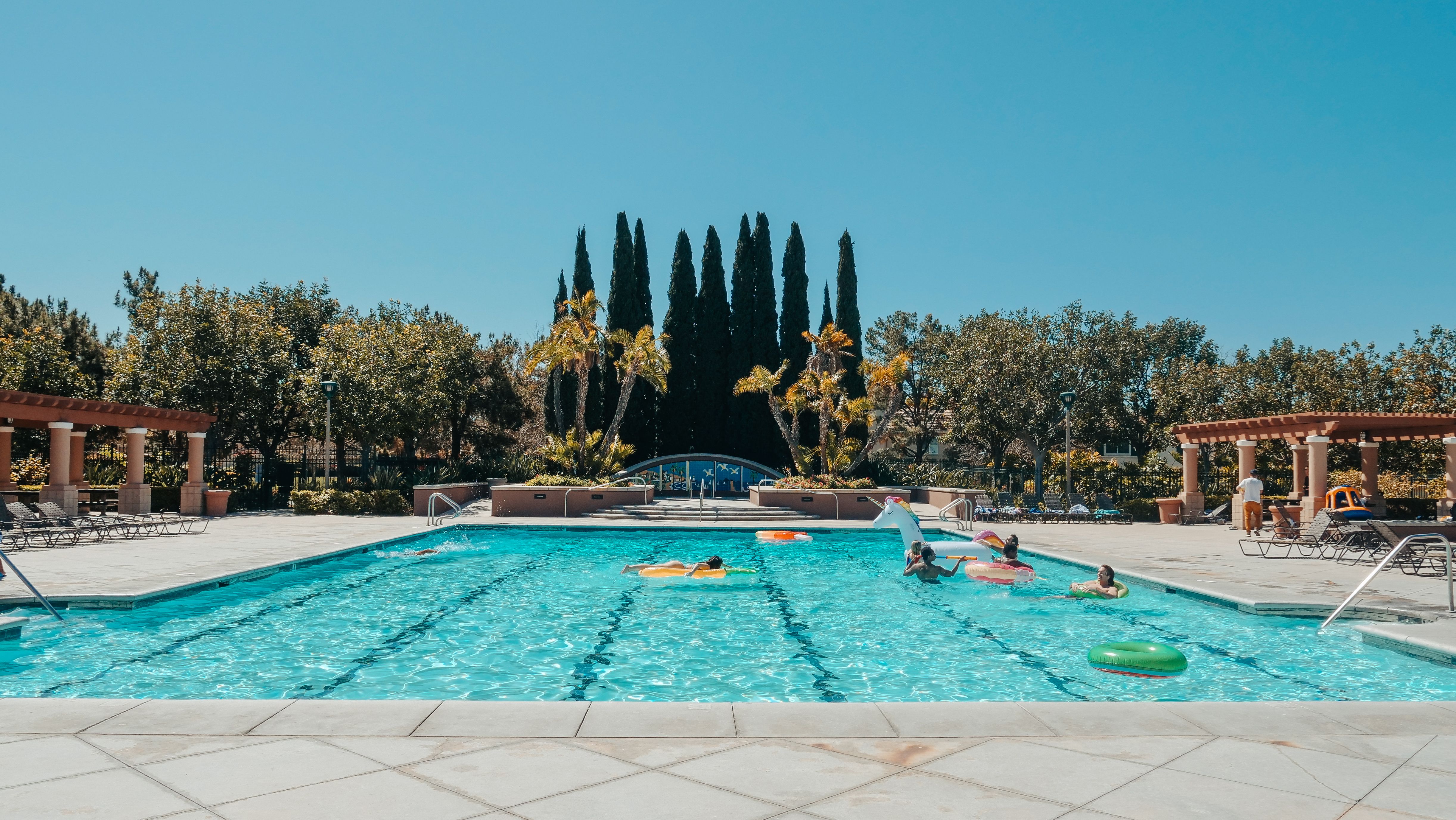 Pool technician performing regular maintenance